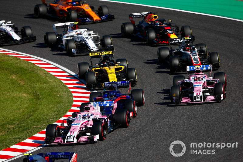 Sergio Perez, Racing Point Force India VJM11, leads Esteban Ocon, Racing Point Force India VJM11, Carlos Sainz Jr., Renault Sport F1 Team R.S. 18, Kevin Magnussen, Haas F1 Team VF-18, Daniel Ricciardo, Red Bull Racing RB14, Charles Leclerc, Sauber C37, Fernando Alonso, McLaren MCL33, and Lance Stroll, Williams FW41, at the start