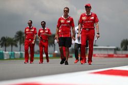 Sebastian Vettel, Ferrari and Riccardo Adami, Ferrari Race Engineer walk the track