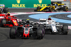 Kevin Magnussen, Haas F1 Team VF-18, leads Charles Leclerc, Sauber C37, and Kimi Raikkonen, Ferrari SF71H