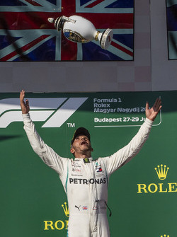 Race winner Lewis Hamilton, Mercedes-AMG F1 celebrates on the podium with the trophy