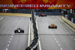 Romain Grosjean, Haas F1 Team VF-18 Ferrari, and Stoffel Vandoorne, McLaren MCL33 Renault