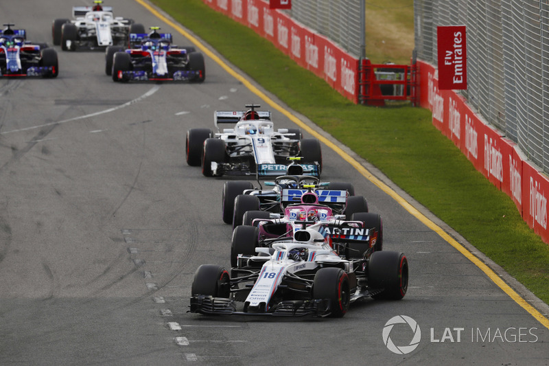 Lance Stroll, Williams FW41 Mercedes, leads Esteban Ocon, Force India VJM11 Mercedes, and Valtteri B