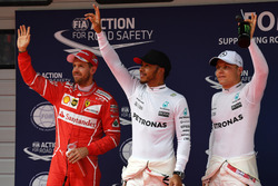 Sebastian Vettel, Ferrari, polesitter Lewis Hamilton, Mercedes AMG F1 and Valtteri Bottas, Mercedes AMG F1 celebrate in parc ferme