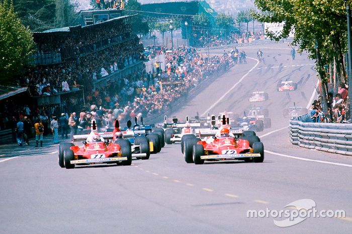 Niki Lauda leads away with teammate Clay Regazzoni, both Ferrari 312T's, and Mario Andretti, Parnell