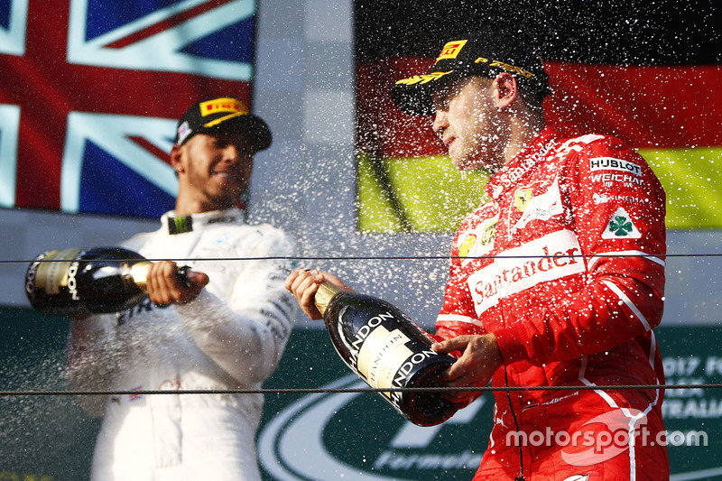 Sebastian Vettel, Ferrari; Lewis Hamilton, Mercedes AMG F1