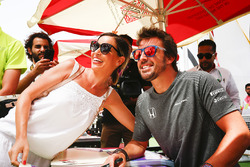 Fernando Alonso, McLaren, has his photo taken with a fan
