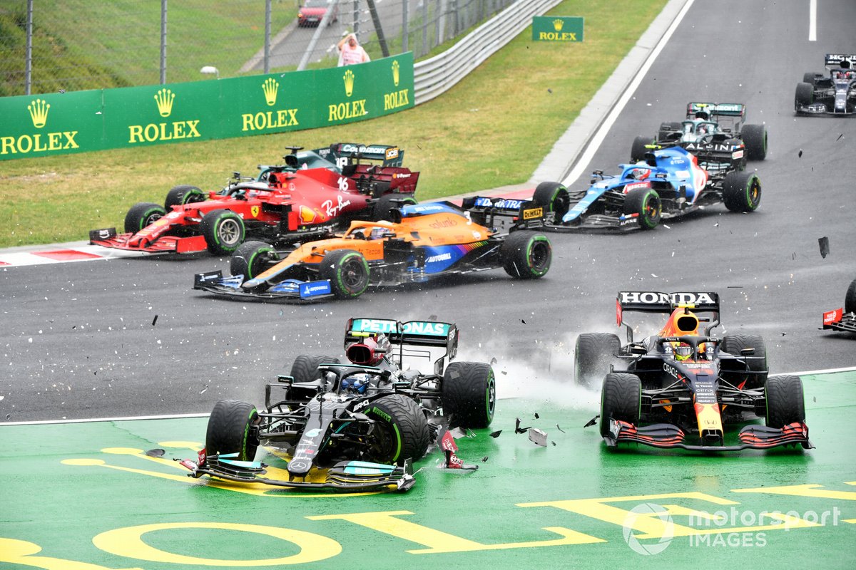 Valtteri Bottas, Mercedes W12, collides with Sergio Perez, Red Bull Racing RB16B, at the start