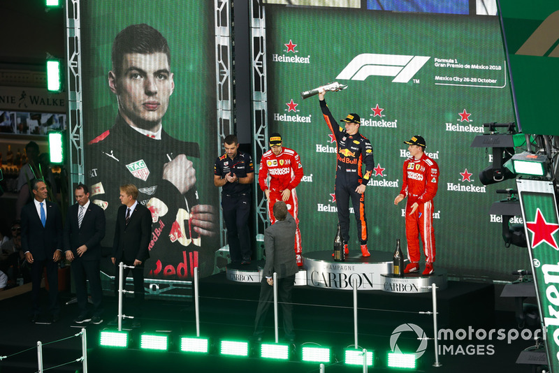 Sebastian Vettel, Ferrari, 2nd position, Max Verstappen, Red Bull Racing, 1st position, and Kimi Raikkonen, Ferrari, 3rd position, on the podium