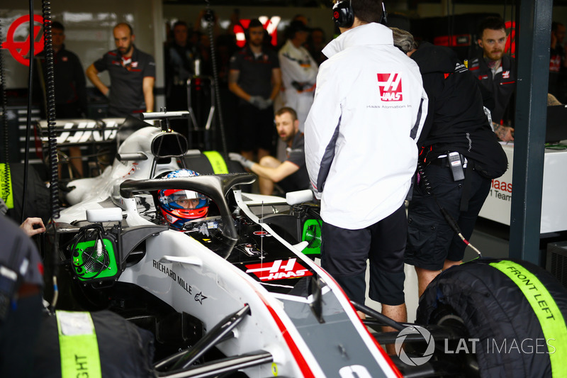 Romain Grosjean, Haas F1 Team VF-18 Ferrari, in the garage