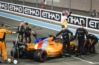 Fernando Alonso, McLaren, waves to the fans after completing his final race in F1