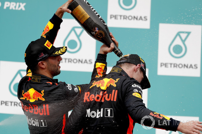 Third place Daniel Ricciardo, Red Bull Racing, pours Champagne down the back of team mate Max Verstappen, Red Bull Racing, race winner, on the podium