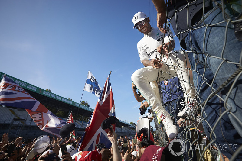 Lewis Hamilton, Mercedes AMG F1, signs autographs for fans