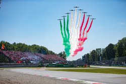 The Italian Ir Force Aerobatics team, Frecce Tricolri, overfly the grid in their Aermacchi MB-339 PAN aircraft