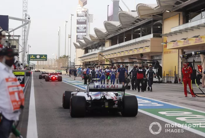 Mick Schumacher, Haas VF-21, heads to the grid