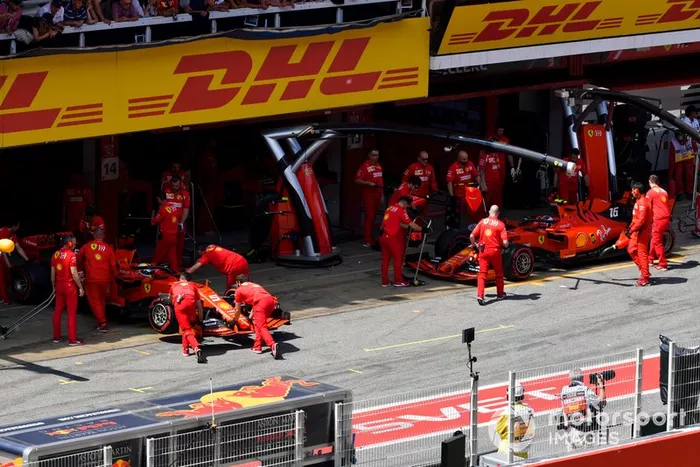 Sebastian Vettel, Ferrari SF90, and Charles Leclerc, Ferrari SF90, at the garage during Qualifying