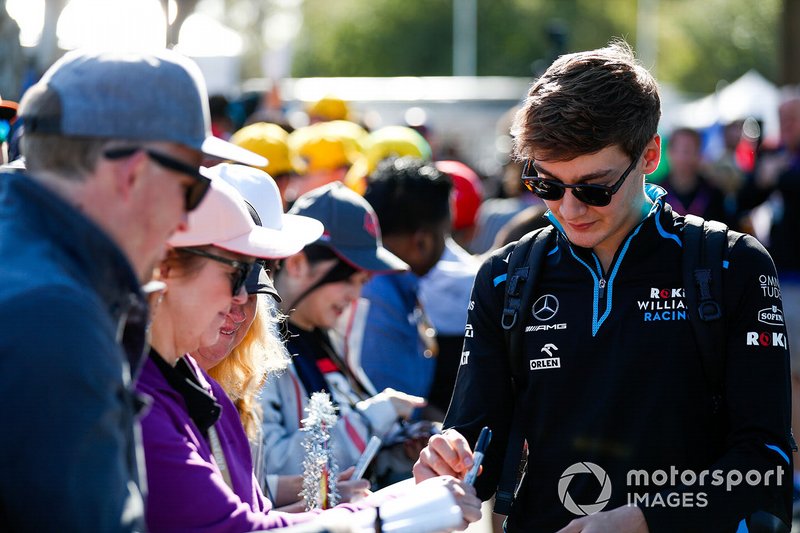 George Russell, Williams Racing, signs autographs for fans