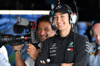 George Russell, Mercedes AMG F1 and Jean-Michel Tibi, FOM Cameraman