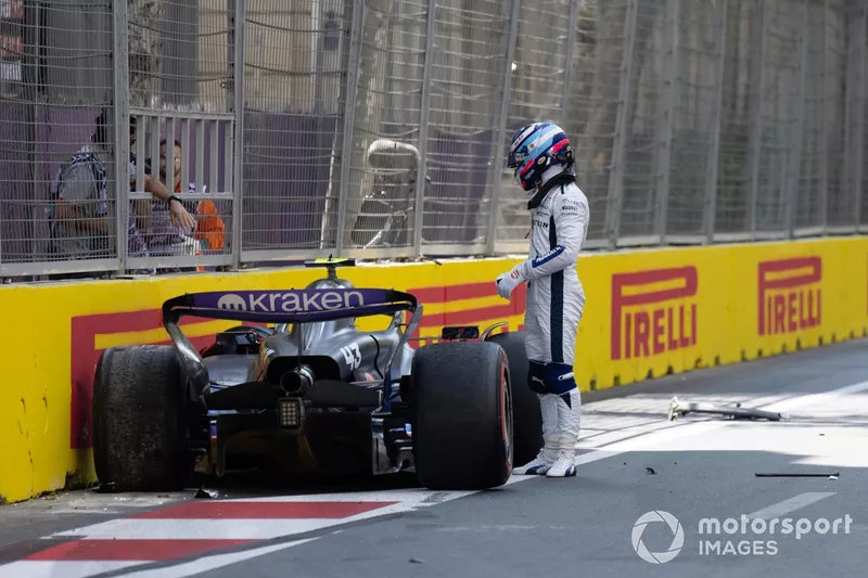 Franco Colapinto, Williams Racing, climbs out of his damaged car after a crash in FP1