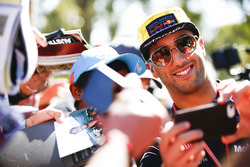 Daniel Ricciardo, Red Bull Racing, takes a photo of himself with a fan