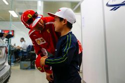 Kimi Raikkonen, Ferrari, meets a young fan