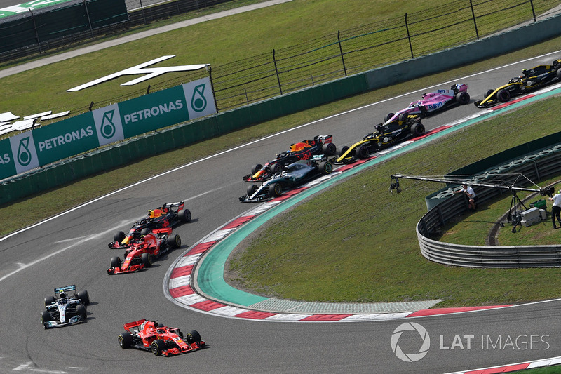 Sebastian Vettel, Ferrari SF71H leads at the start of the race