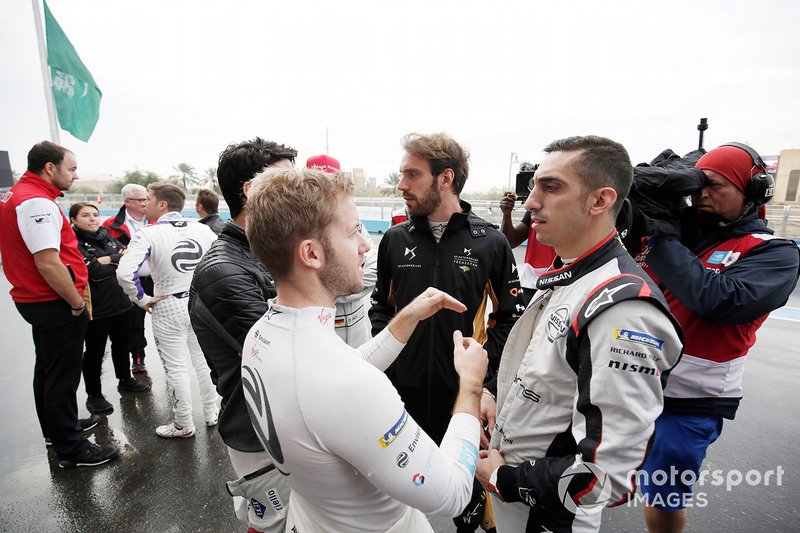 The drivers meet in the pit lane