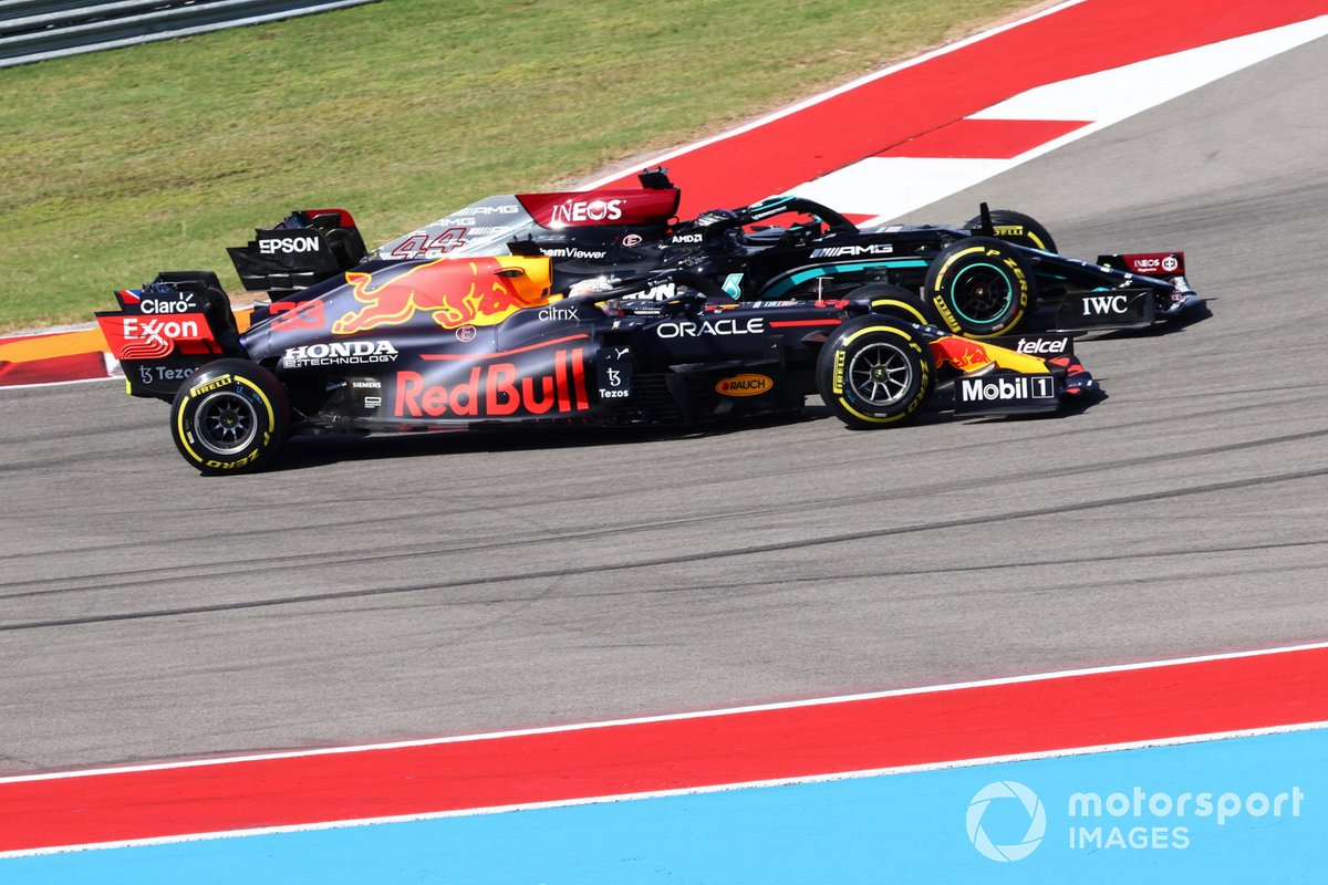 Max Verstappen, Red Bull Racing RB16B, battles with Lewis Hamilton, Mercedes W12, at the start