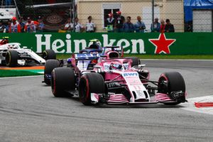 Sergio Perez, Racing Point Force India VJM11, leads Pierre Gasly, Toro Rosso STR13, and Charles Leclerc, Sauber C37