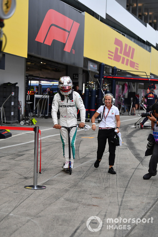 Lewis Hamilton, Mercedes AMG F1 on a scooter with Angela Cullen, Physio and PA