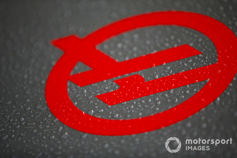 Haas F1 logo with rain water