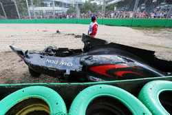 The McLaren MP4-31 of Fernando Alonso, McLaren is removed from the gravel trap after his race stopping crash