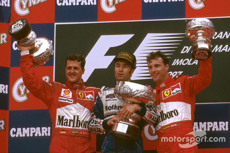 Podium: Race winner Heinz-Harald Frentzen, Williams FW19 Renault, second place Michael Schumacher, Ferrari, third place Eddie Irvine, Ferrari