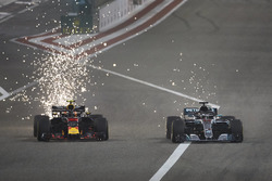 Sparks fly as Max Verstappen, Red Bull Racing RB14 Tag Heuer, battles with Lewis Hamilton, Mercedes AMG F1 W09