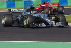 Valtteri Bottas, Mercedes AMG F1 W09, leads Sebastian Vettel, Ferrari SF71H