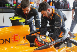Engineers help Stoffel Vandoorne, McLaren MCL33, strap in to his seat