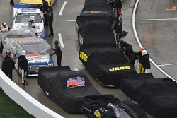 Noah Gragson, Kyle Busch Motorsports, Toyota Tundra Safelite, Cody Coughlin, GMS Racing, Chevrolet Silverado Jeg's.com crews cover the trucks during a rain delay