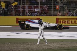 Lance Stroll, Williams FW40, walks away from his damaged car after a collision with Carlos Sainz Jr., Scuderia Toro Rosso