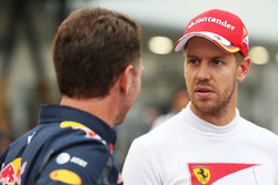 (L to R): Christian Horner, Red Bull Racing Team Principal with Sebastian Vettel, Ferrari