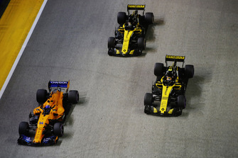 Fernando Alonso, McLaren MCL33, leads Carlos Sainz Jr., Renault Sport F1 Team R.S. 18, and Nico Hulkenberg, Renault Sport F1 Team R.S. 18
