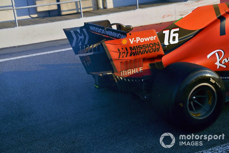 Smoke from the rear of the Ferrari SF90