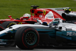 Sebastian Vettel, Ferrari SF70H, passes Valtteri Bottas, Mercedes AMG F1 W08