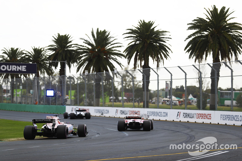 Esteban Ocon, Force India VJM10, follows a Ferrari and a Williams