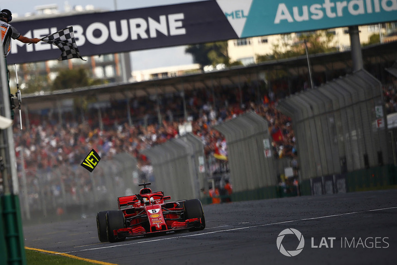 Race winner Sebastian Vettel, Ferrari SF71H crosses the line and takes the chequered flag