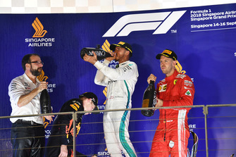 Max Verstappen, Red Bull Racing, Lewis Hamilton, Mercedes AMG F1 and Sebastian Vettel, Ferrari celebrate on the podium with the champagne