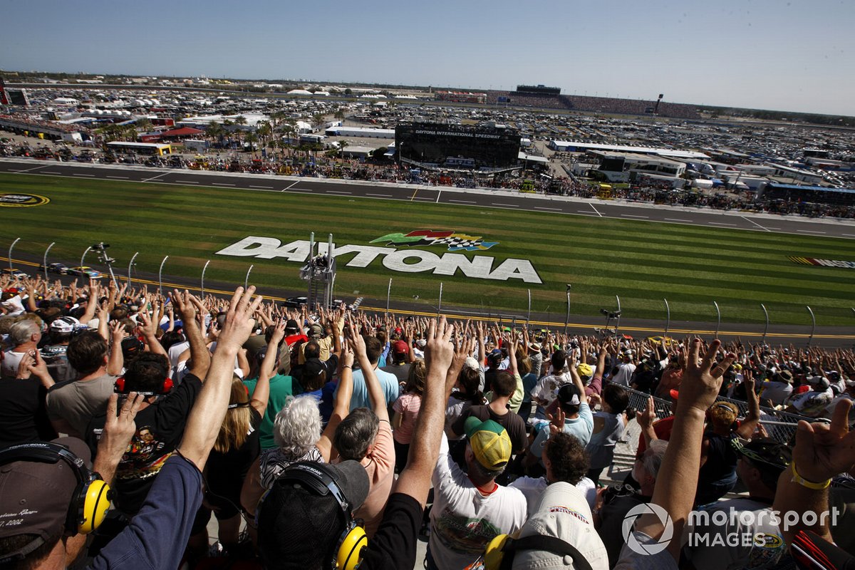 Fans hold up three fingers on the 3rd lap to remember Dale Earnhardt ten years after he died 