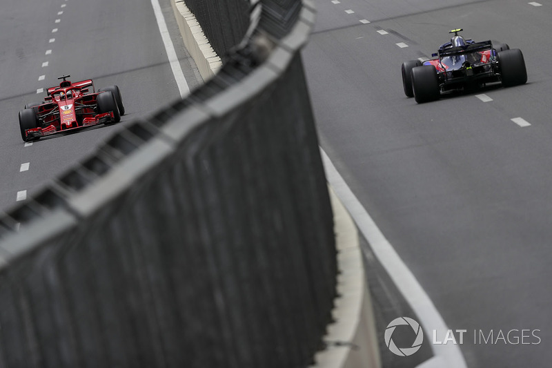 Sebastian Vettel, Ferrari SF71H and Pierre Gasly, Scuderia Toro Rosso STR13