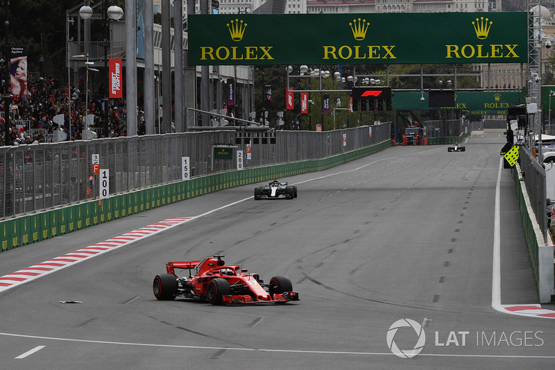 Sebastian Vettel, Ferrari SF71H leads Lewis Hamilton, Mercedes-AMG F1 W09 EQ Power+