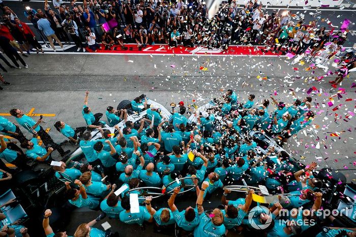 The Mercedes team celebrates victory in the race and the Constructors championship