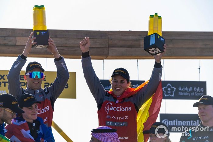 Mattias Ekstrom, Acciona | Sainz XE Team, and Laia Sanz, Sainz XE Team, 1st position, with their trophies on the podium