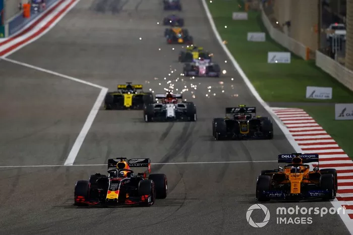 Max Verstappen, Red Bull Racing RB15, leads Carlos Sainz Jr., McLaren MCL34, Kevin Magnussen, Haas F1 Team VF-19, and Kimi Raikkonen, Alfa Romeo Racing C38